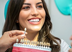 A woman smiling after professional teeth whitening