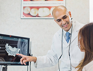 Dentist showing patient images