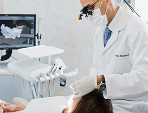 Dentist treating patient