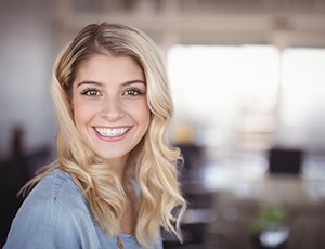 woman smiling after getting cosmetic dental bonding in Herndon