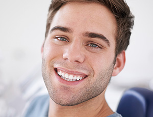 Smiling man in dental chair