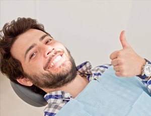  man smiling thumb up