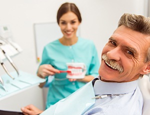 An image of complete dentures and removable partial dentures on a table