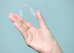 Patient holding clear aligner