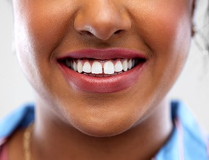 young woman with a gap between her front teeth and in need of Invisalign