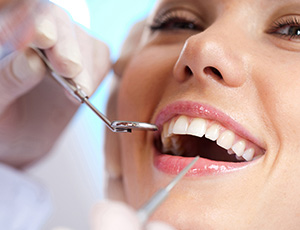 Woman receiving gum disease treatment