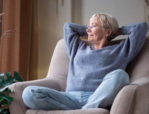 Woman relaxing in her favorite armchair 