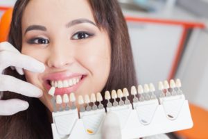 woman smiling beside shade guide