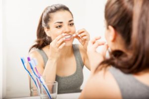 woman using whitening strip