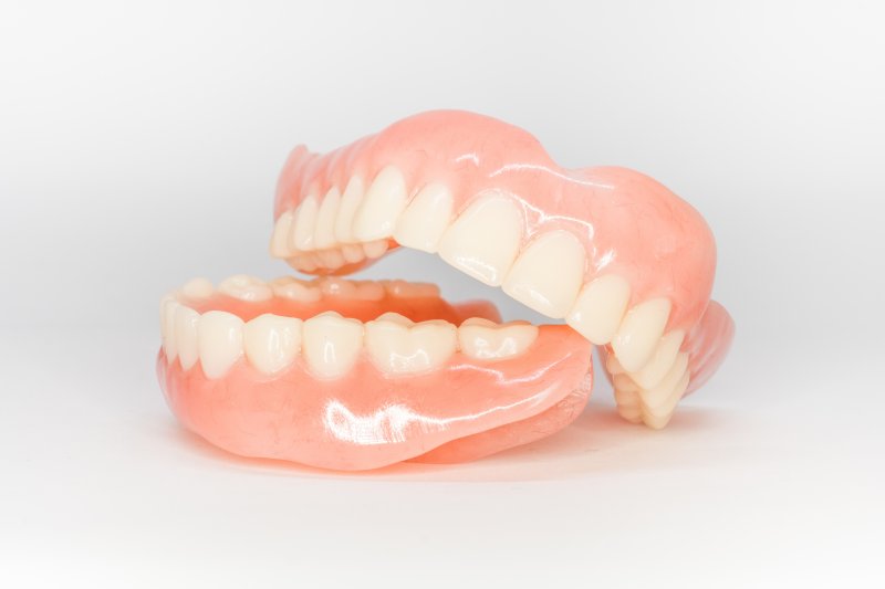 an up-close look at a top and bottom denture