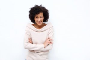 woman smiling and looking young with dental implants