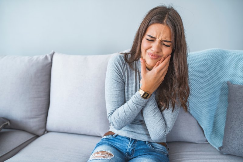 young woman with tooth infection