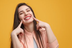 patient smiling after receiving cosmetic dental work in Herndon