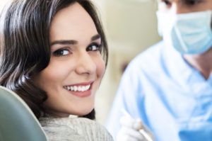 a patient smiling while visiting their cosmetic dentist in Herndon