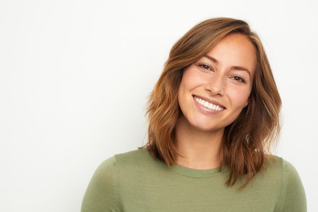 person with dental fillings smiling