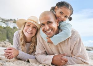 a family smiling with healthy teeth