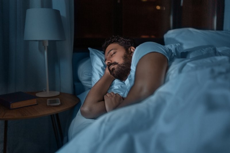 A man trying to sleep with a toothache