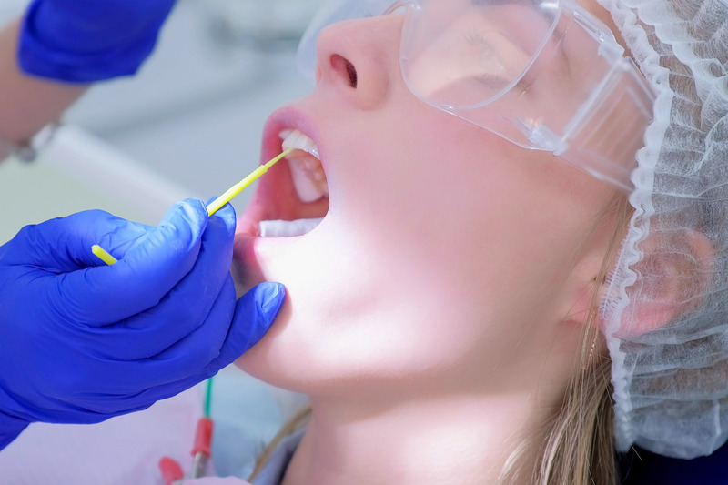 Patient getting an oral cancer screening
