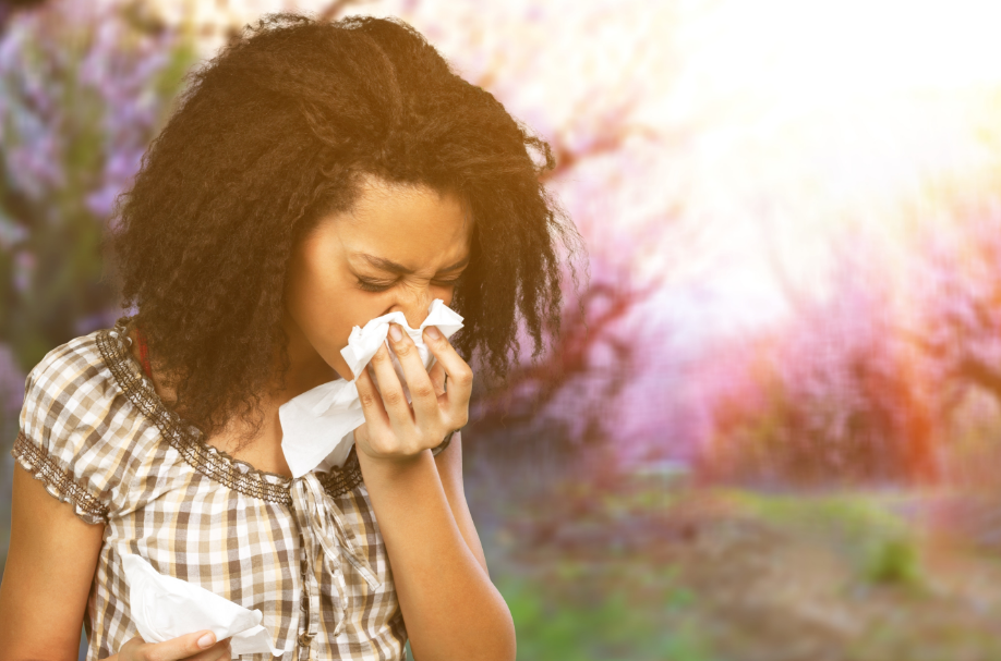 Woman blowing nose