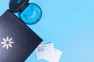 Invisalign welcome packet including case, trays, cleaning crystals, and folder